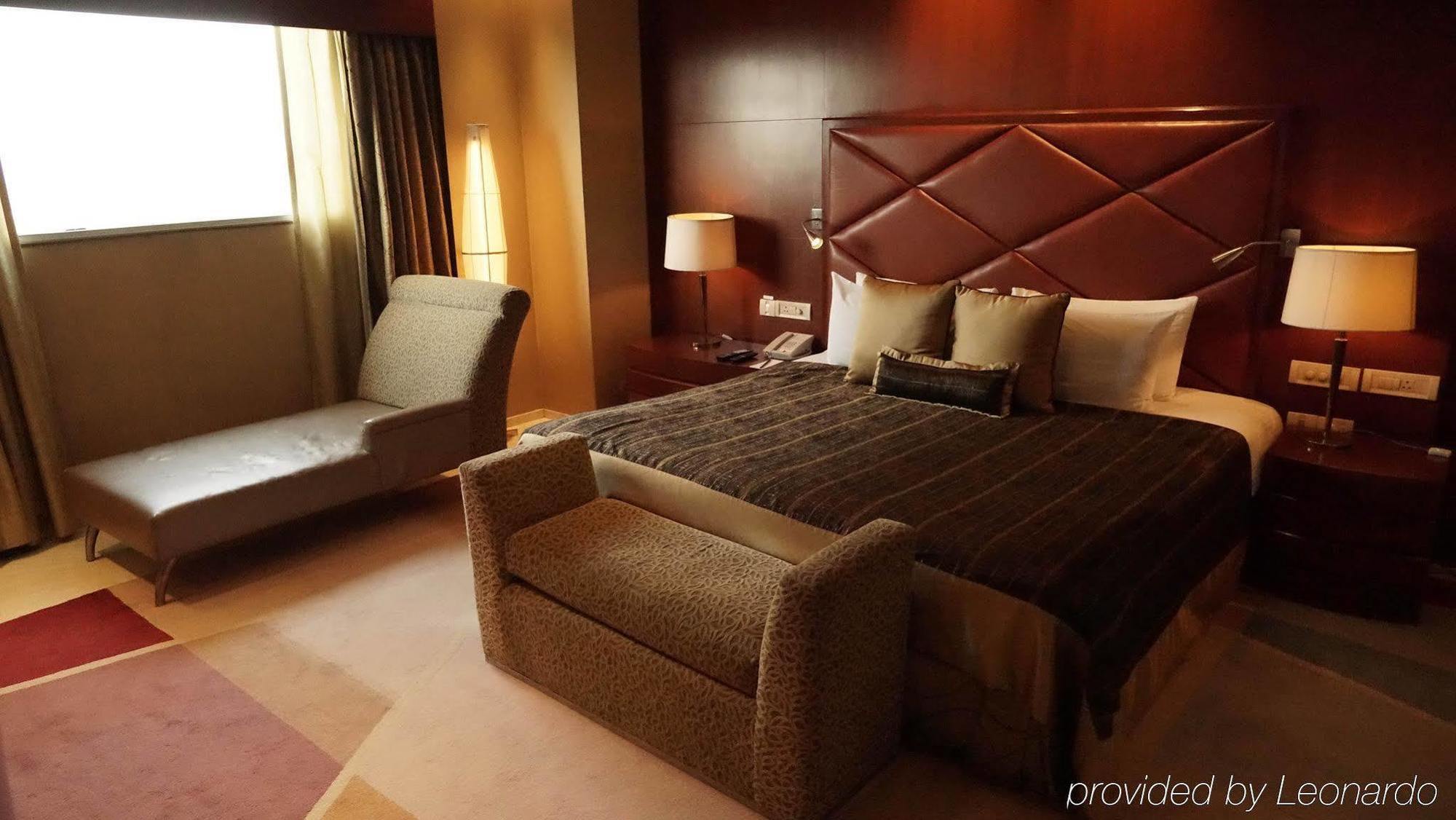 Taj Чандигарх Экстерьер фото A bedroom in the hotel